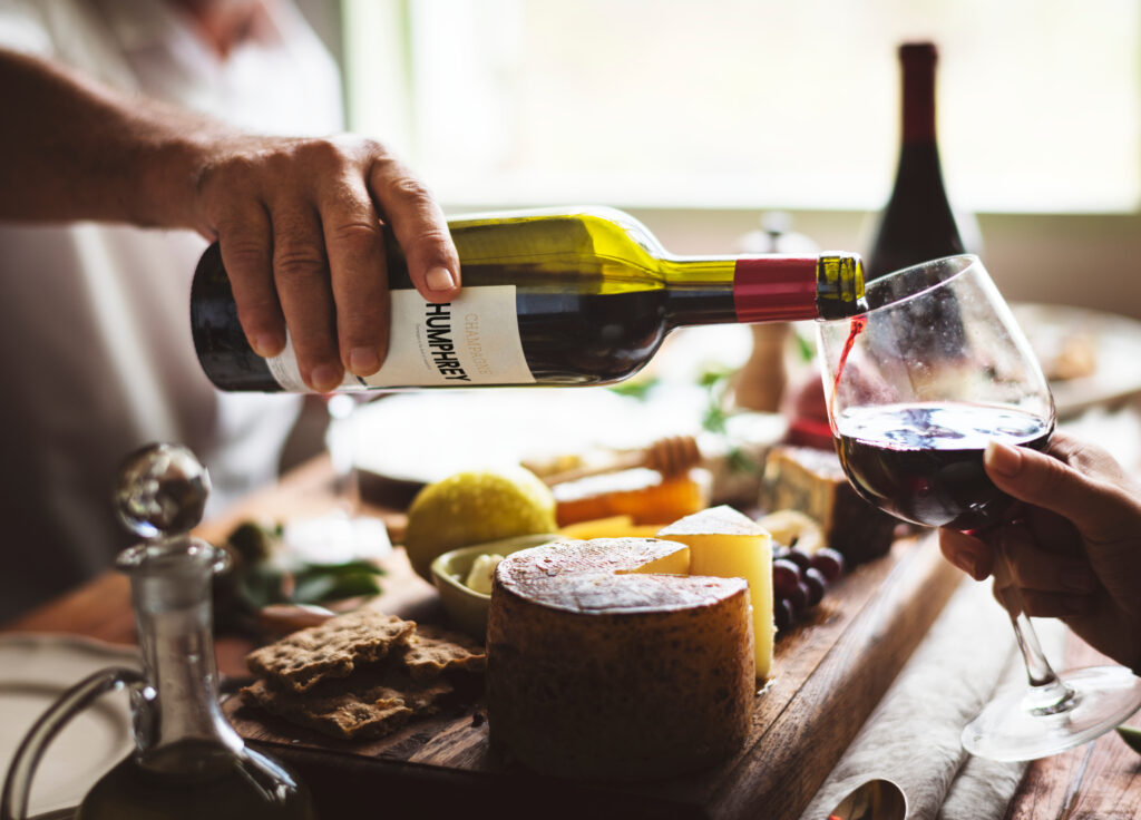 Man Pouring Red Wine Into A Glass