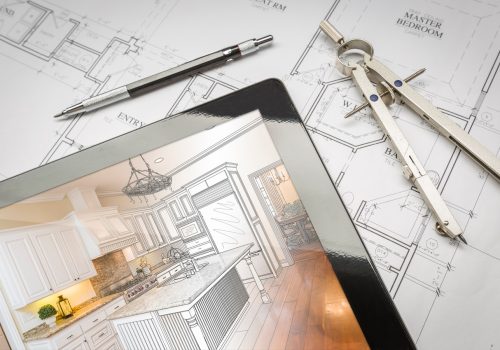 Computer Tablet Showing Kitchen Illustration Sitting On House Plans With Pencil And Compass.